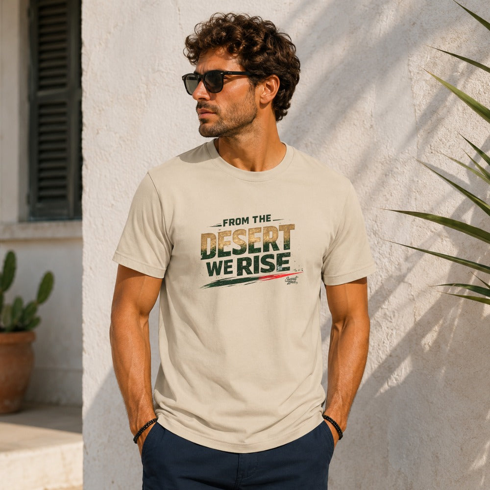 Man wearing a tan t-shirt with "FROM THE DESERT WE RISE" graphic.