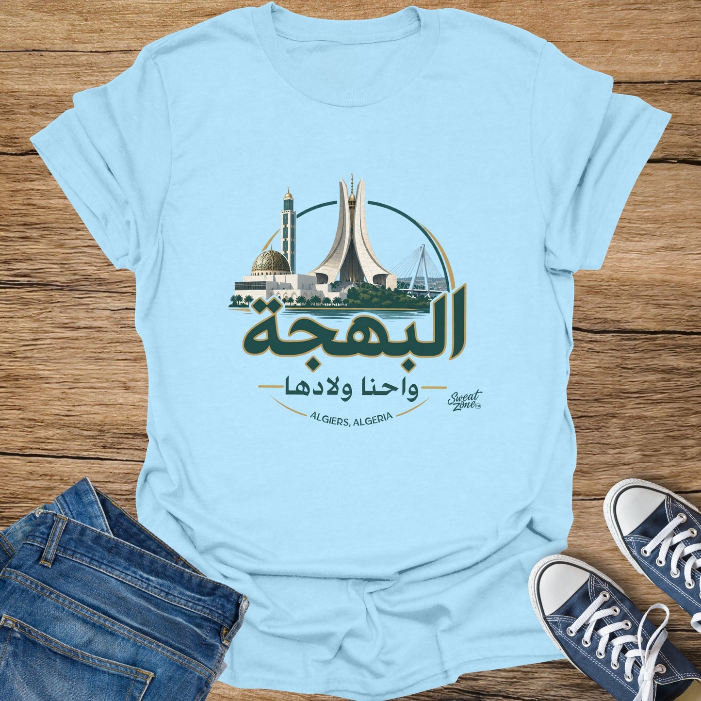 Light blue t-shirt with Algiers landmarks and Arabic text.