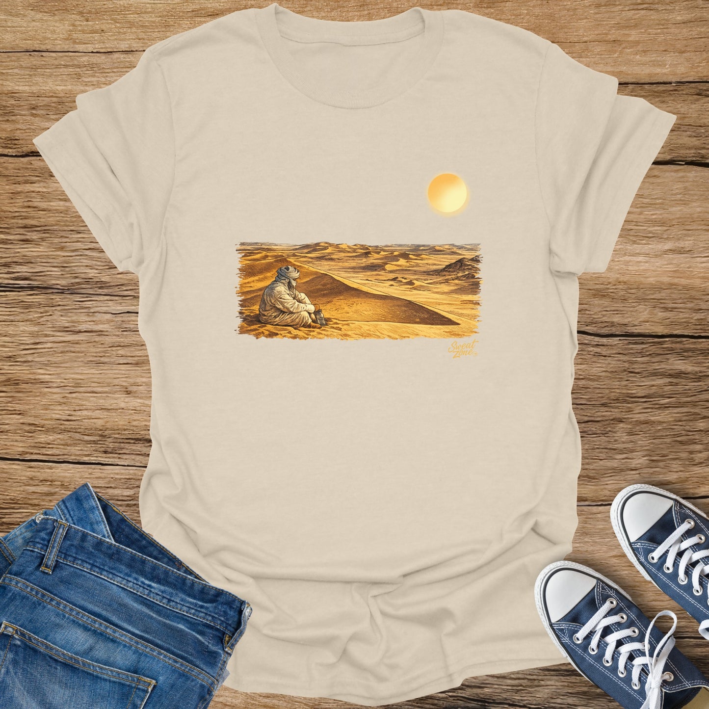 Light cream t-shirt with a desert scene and "Sweat Zone" text.