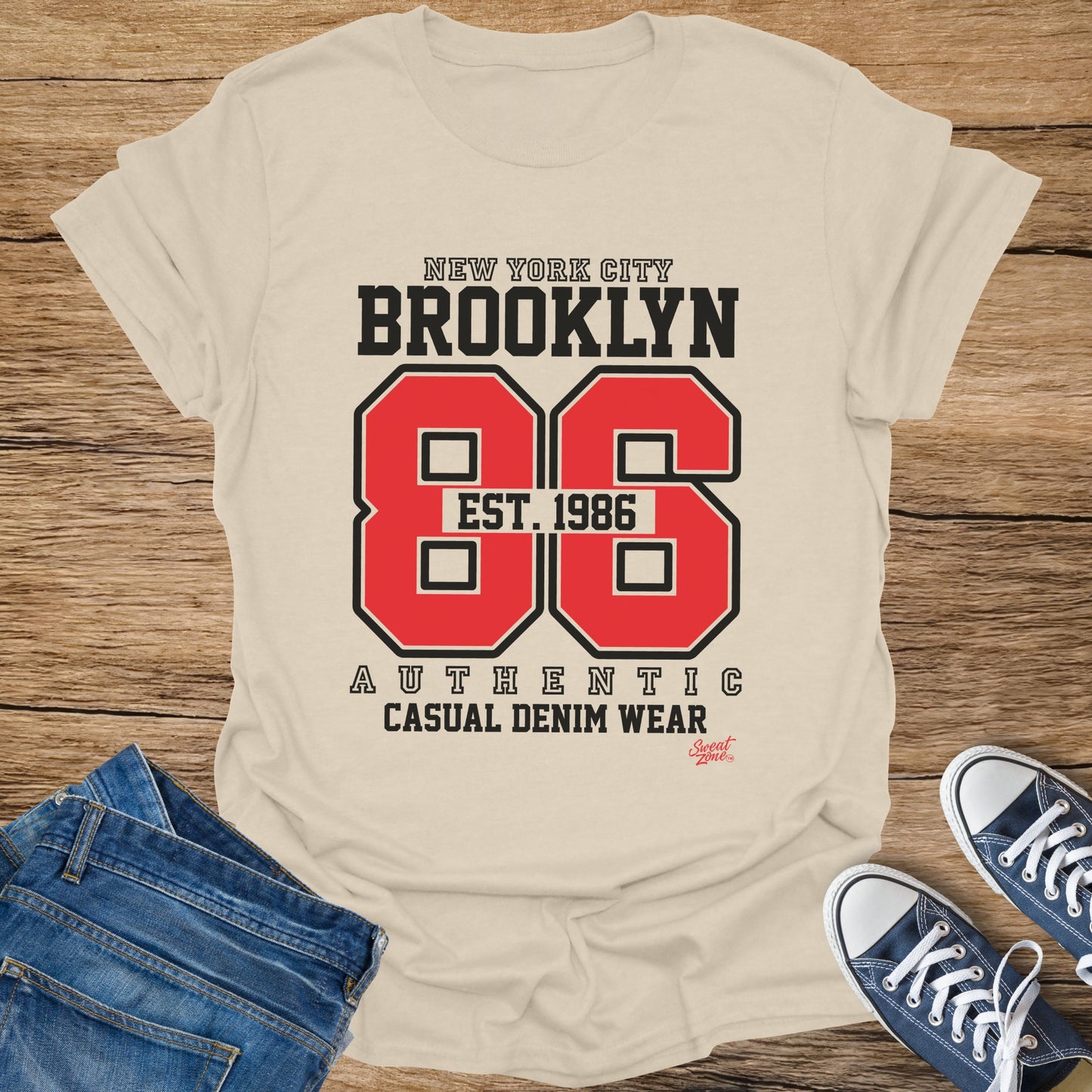 Cream t-shirt with "New York City Brooklyn 86 Est. 1986" graphic.