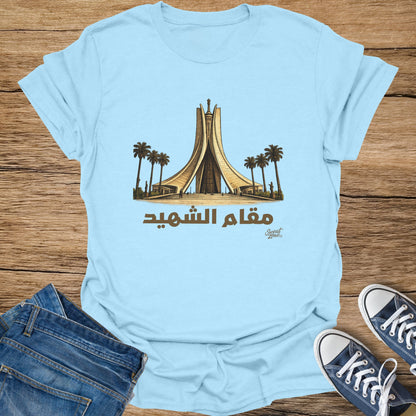 Light blue t-shirt with Maqam Ech Chahid monument and Arabic text.