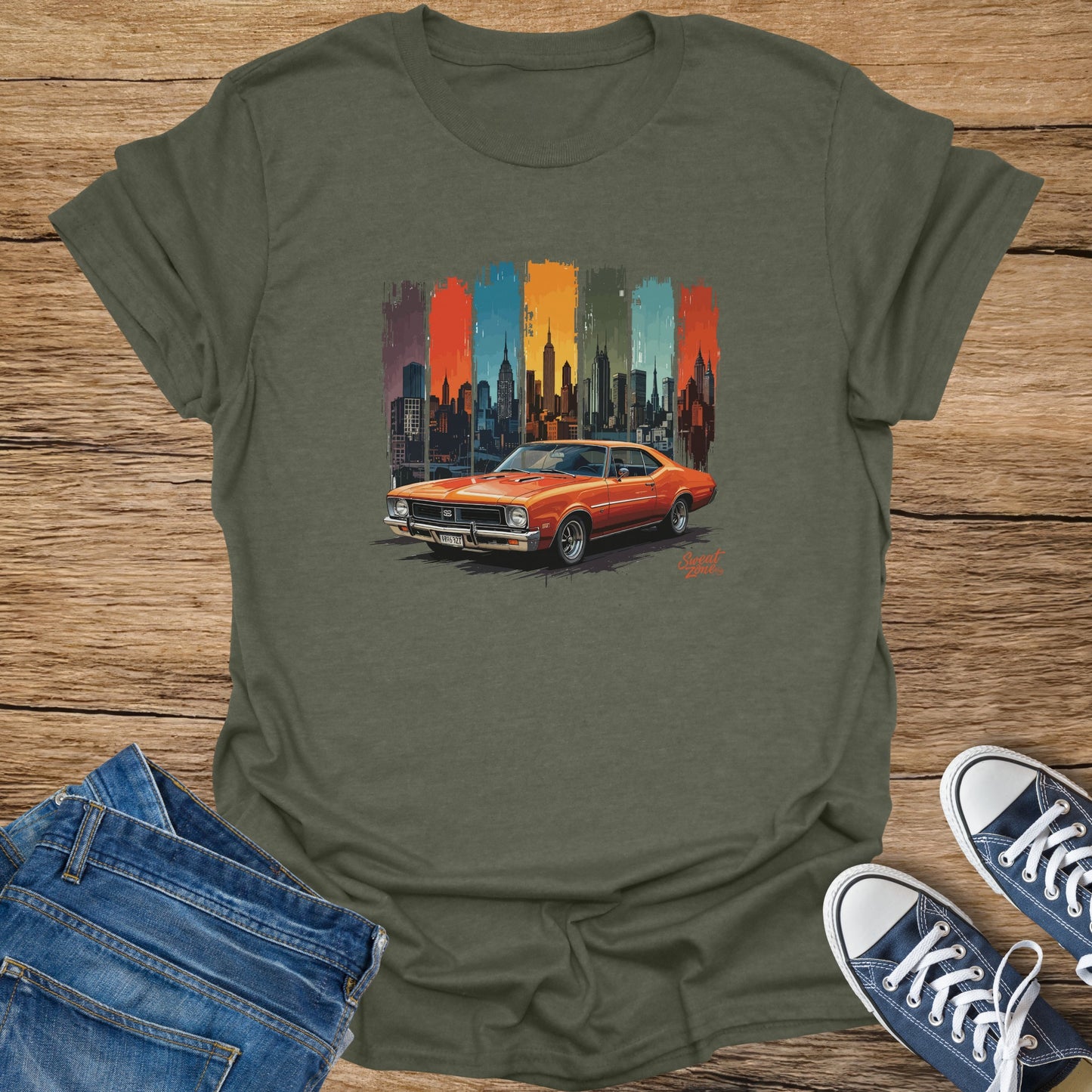 Orange muscle car in front of New York City skyline with colorful vertical stripes.