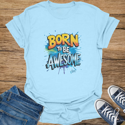 Light blue t-shirt with "BORN TO BE AWESOME" graphic and splattered paint design.