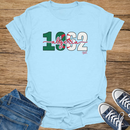 Light blue t-shirt with "1962 Algeria" and a small "Sweat Zone" logo.