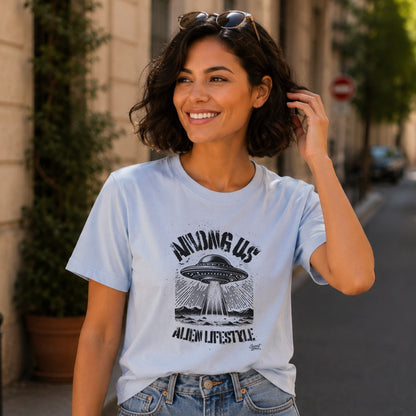 Light blue t-shirt with black graphic: "Among Us Alien Lifestyle" and a UFO.