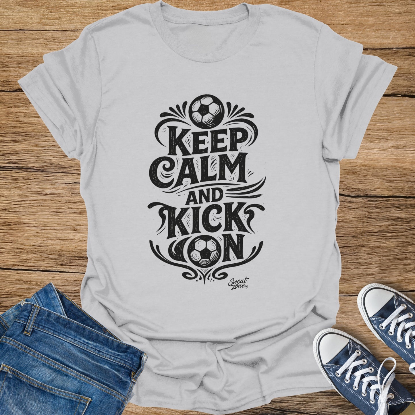 White t-shirt with "Keep Calm and Kick On" text and soccer ball graphics.