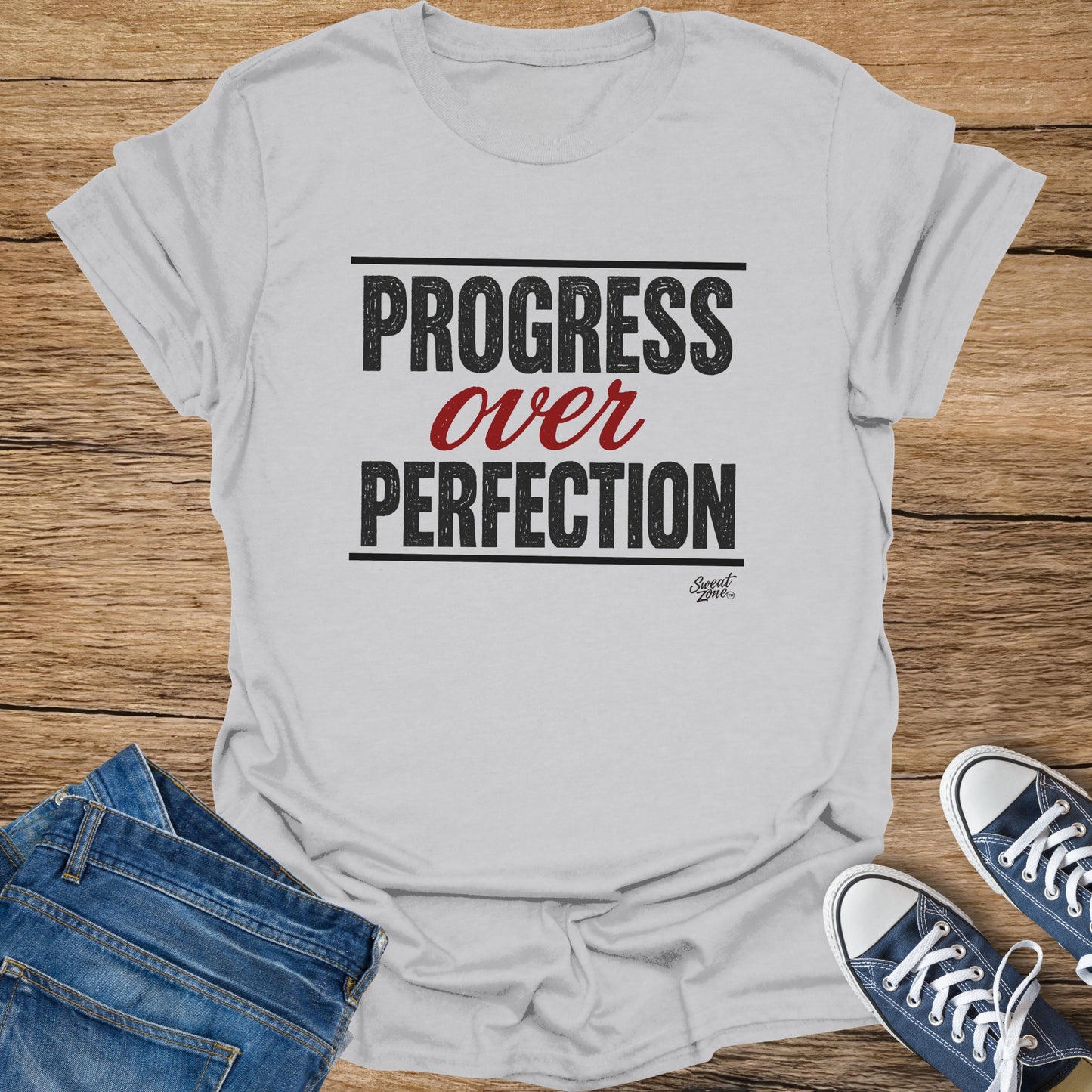 Grey t-shirt with "PROGRESS over PERFECTION" text and "Sweat Zone" logo.