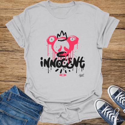 Light grey t-shirt with pink dripping crown design and black "innocent" text.