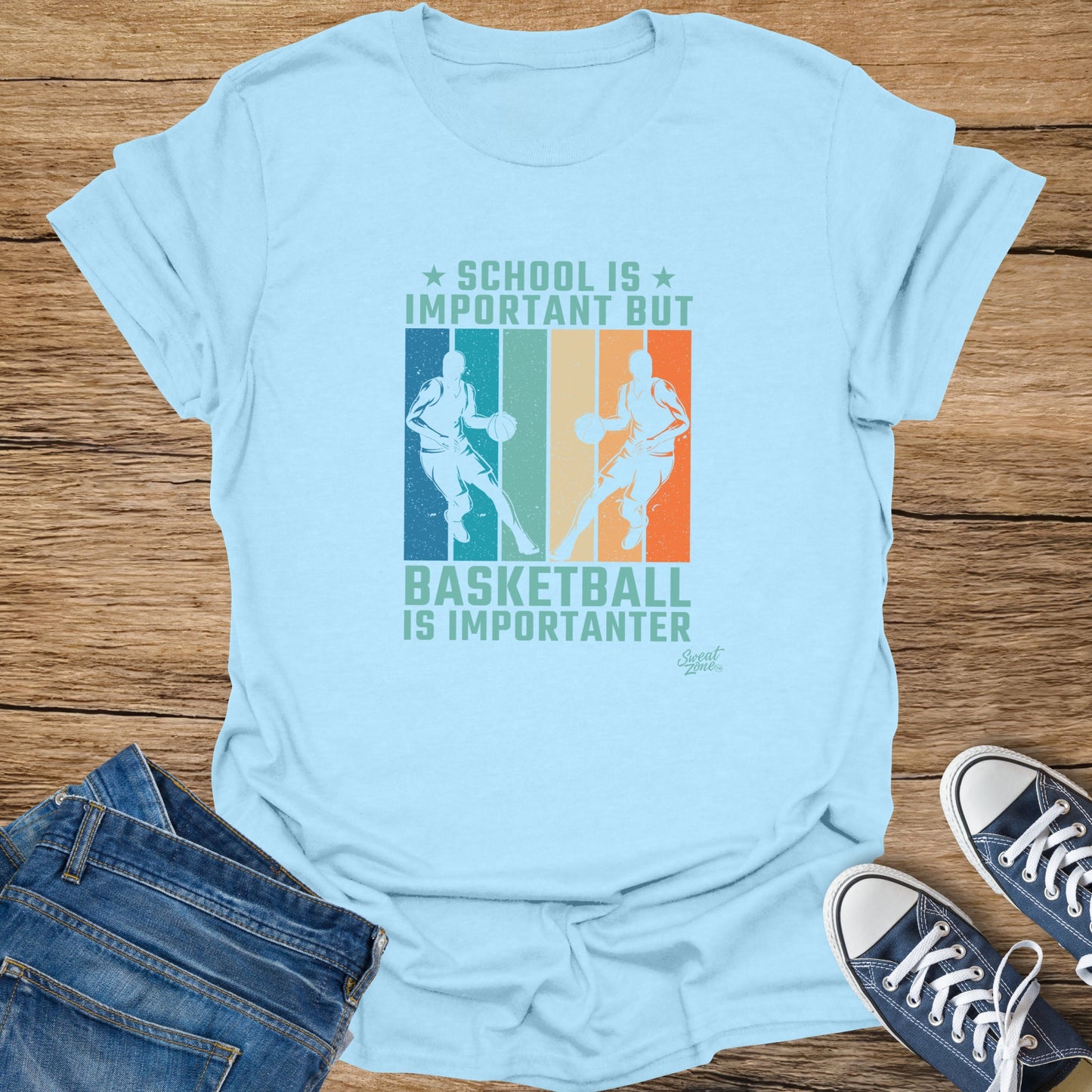 Light blue t-shirt with "School is Important But Basketball Is Importanter" text and basketball player graphics.