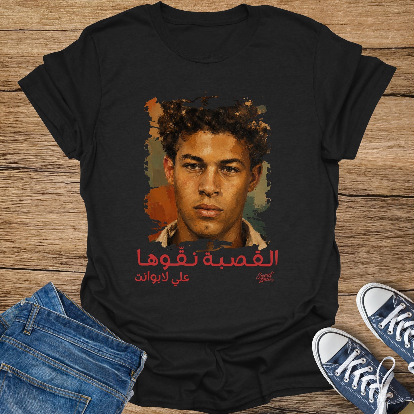 Black t-shirt with portrait and Arabic text.