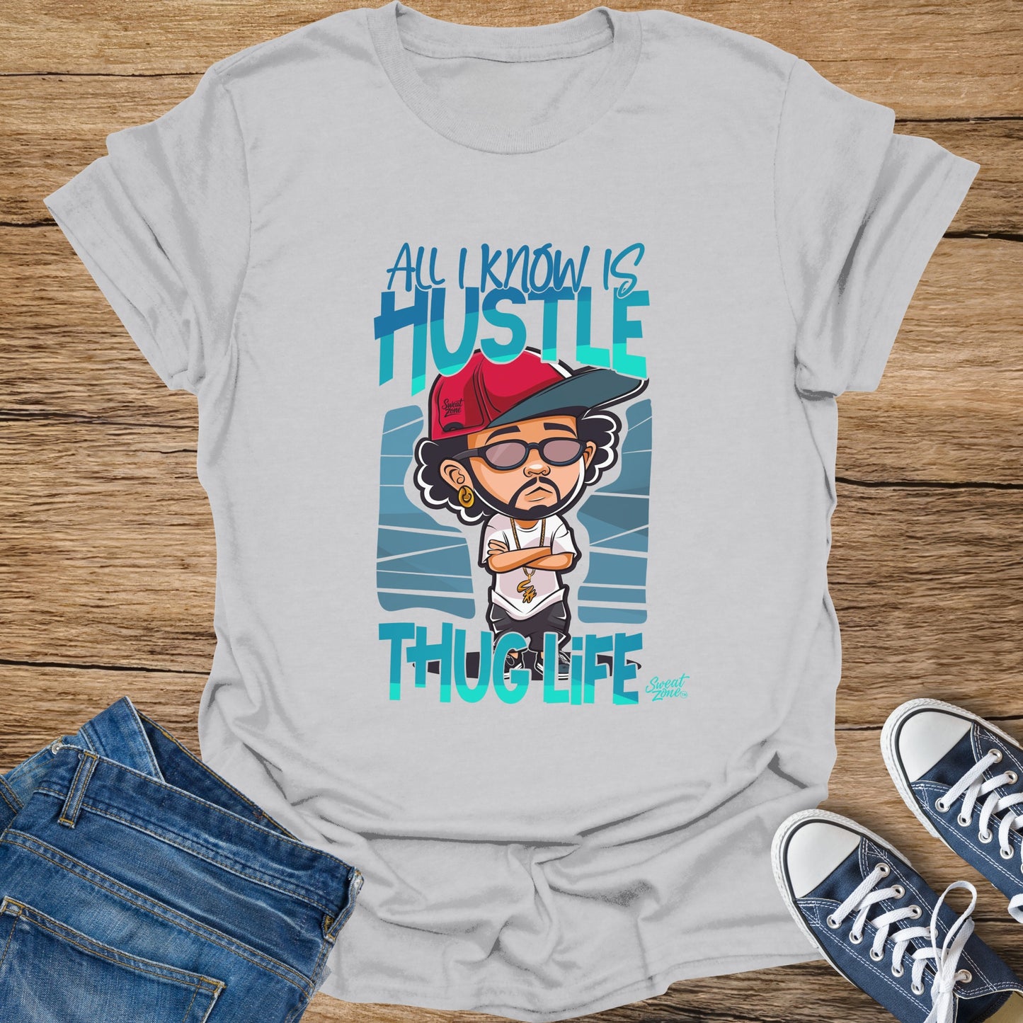 White shirt with cartoon man, "All I Know Is Hustle Thug Life" text.