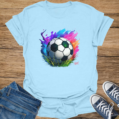 Light blue t-shirt with watercolor soccer ball design and "Sweat Zone" logo.