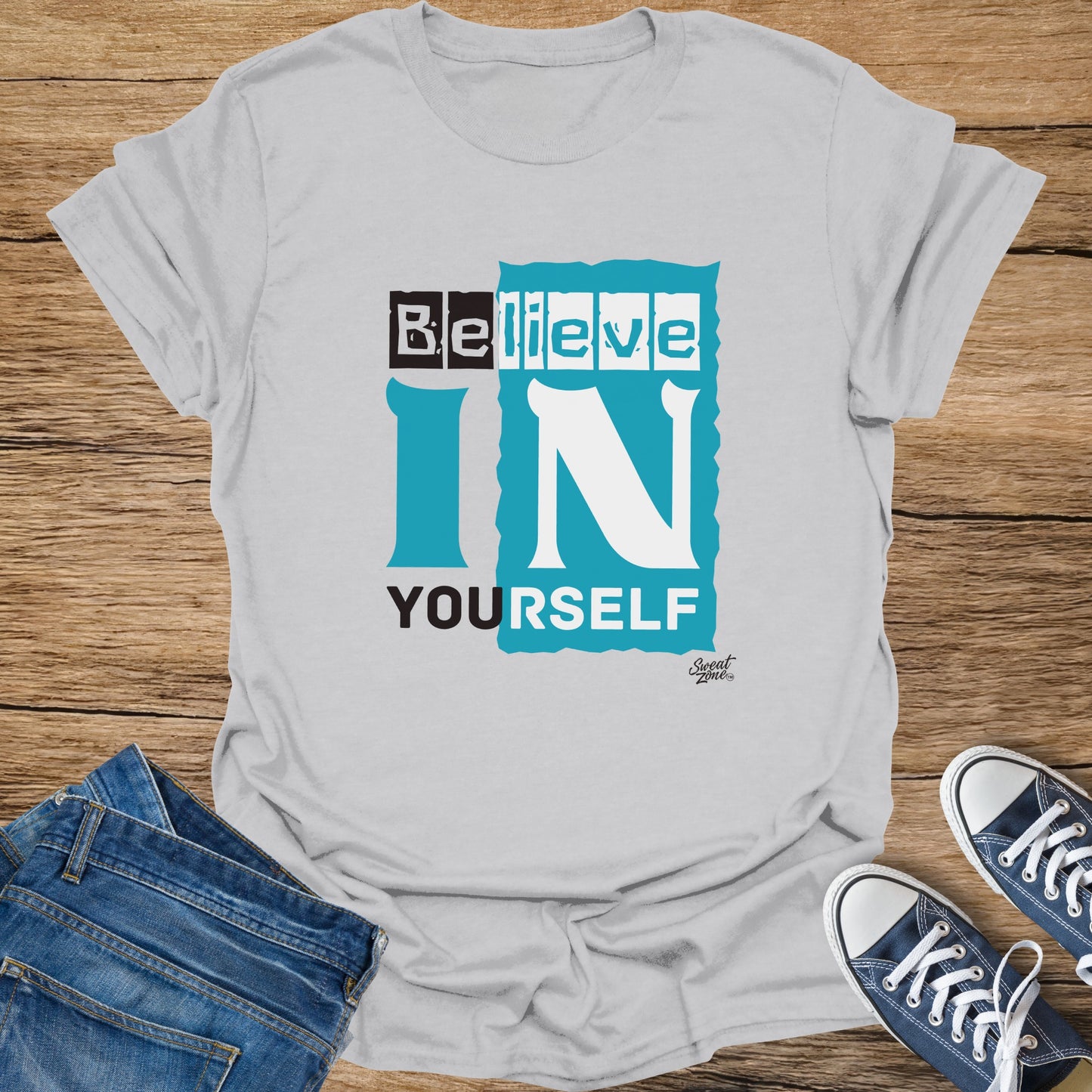 Light grey t-shirt with text "Believe IN YOURSELF" and "Sweat Zone" logo.