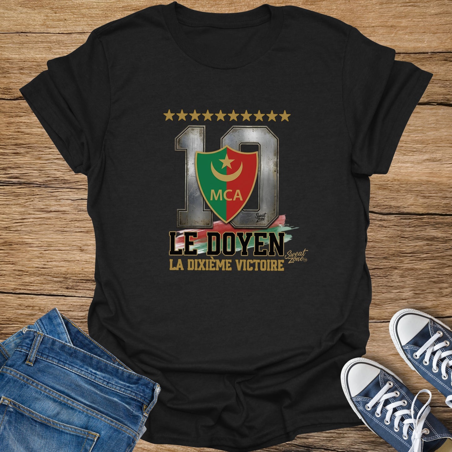 Black t-shirt with large text and shield graphic: "LE DOYEN LA DIXIÈME VICTOIRE"
