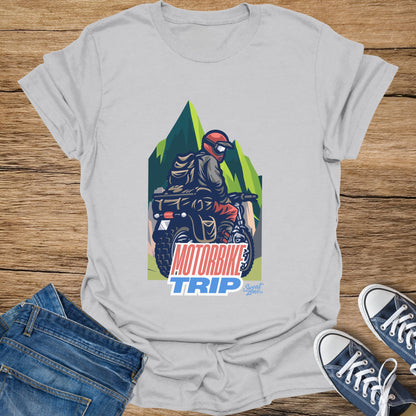 T-shirt graphic with rider on motorbike in mountains and text MOTORBIKE TRIP.