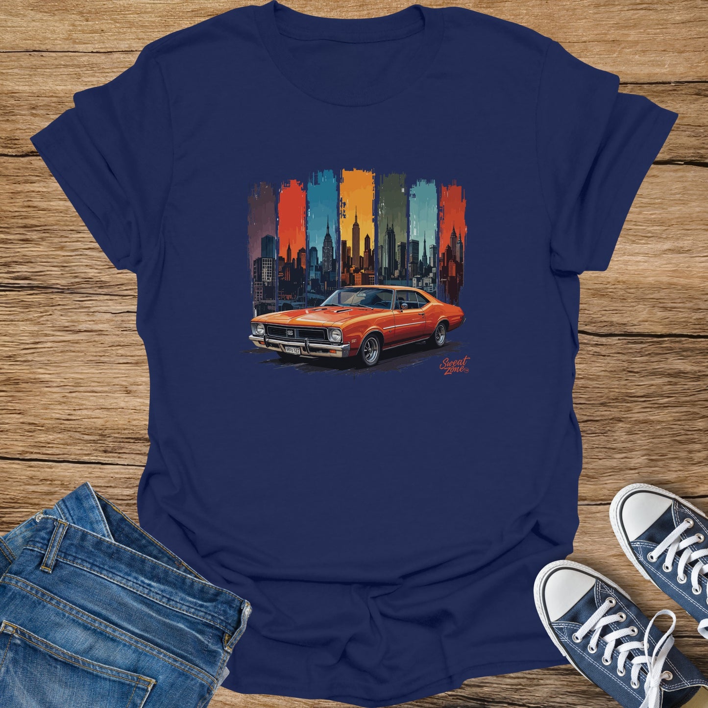 Orange classic car illustration with New York City skyline on a navy t-shirt.