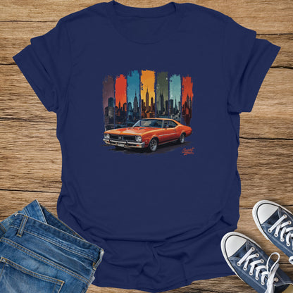 Orange classic car illustration with New York City skyline on a navy t-shirt.