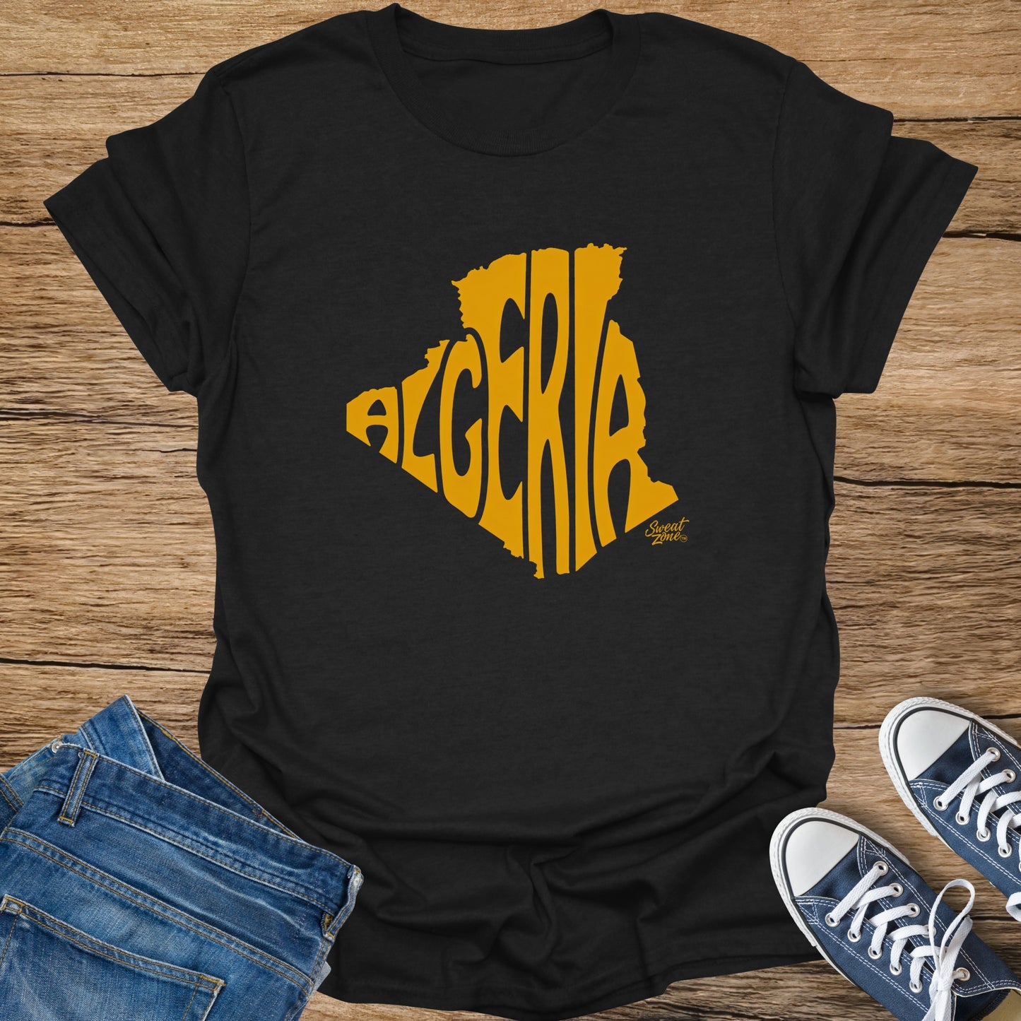 Black t-shirt with yellow Algeria map outline filled with textured letters and "Sweat Zone" logo.