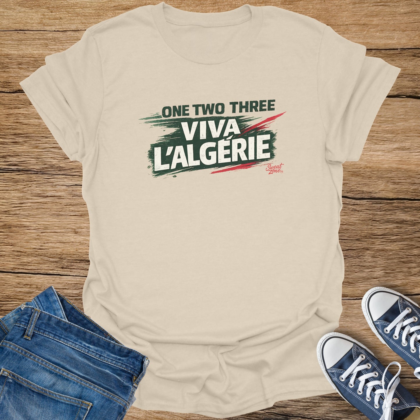 Light cream t-shirt with "ONE TWO THREE VIVA L'ALGERIE" text and stripes.
