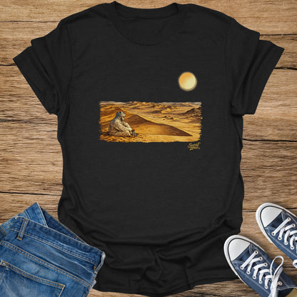 Black t-shirt with desert scene print featuring a person and a lantern.
