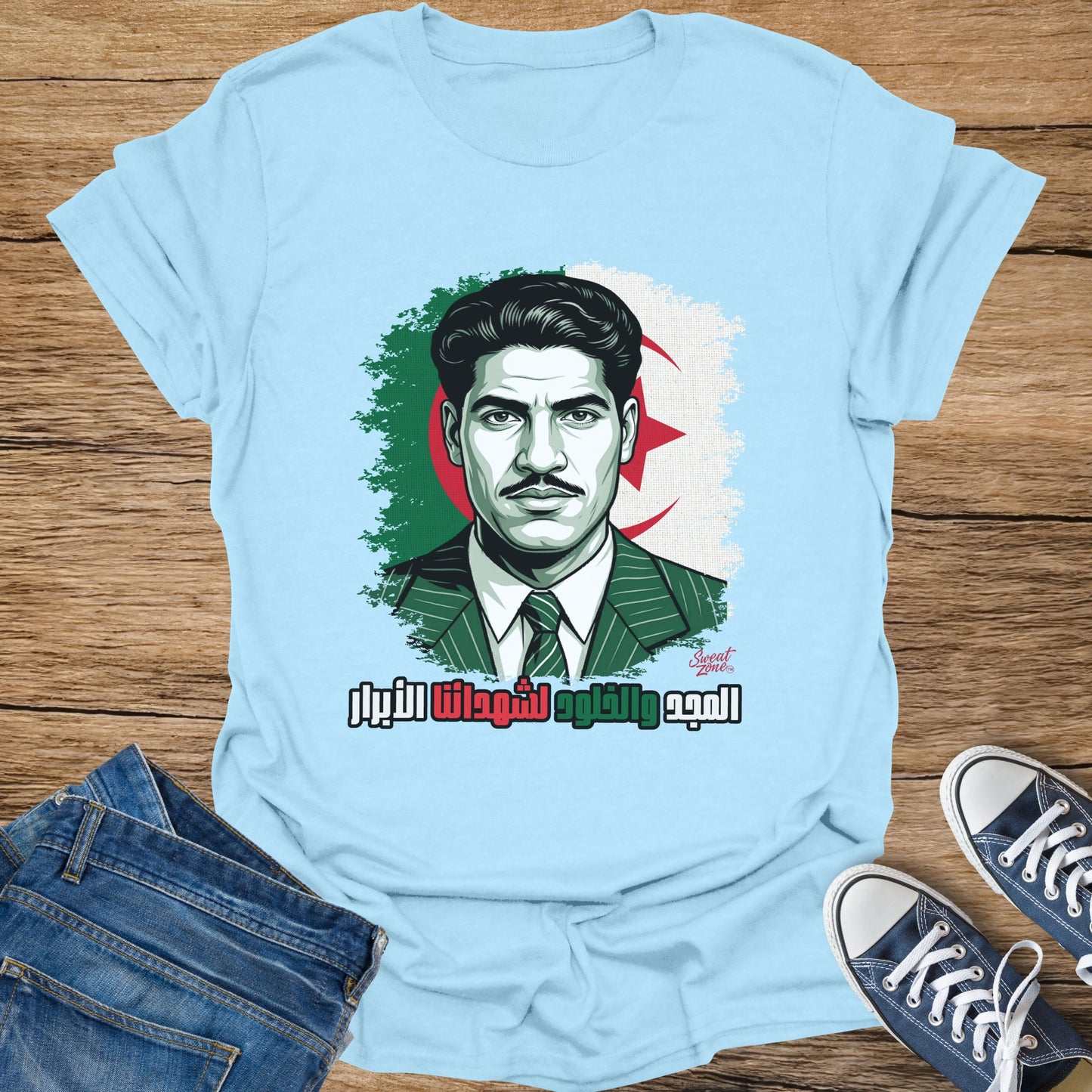 Light blue t-shirt featuring a portrait of a man with an Algerian flag and text.