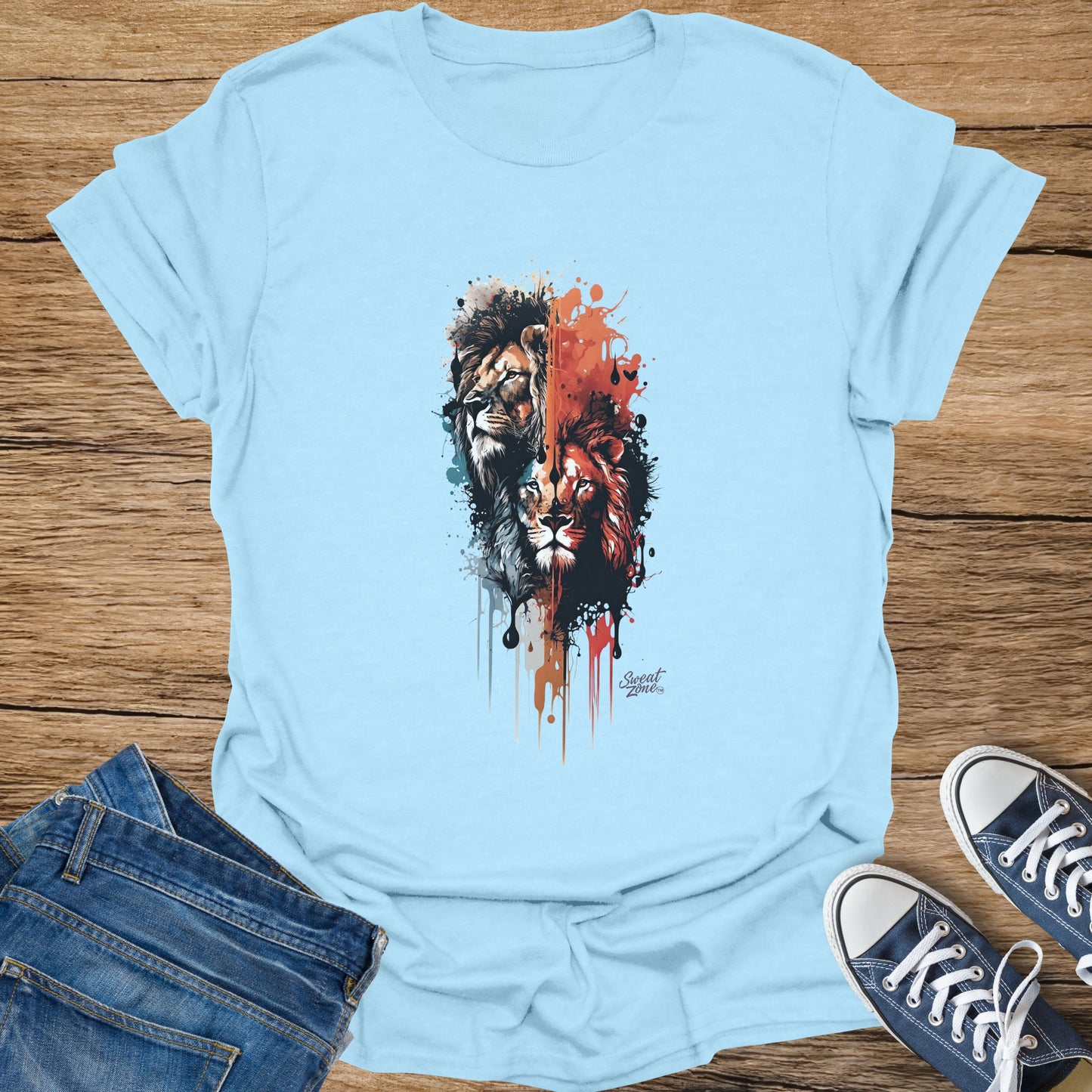 Light blue t-shirt with splatter art of two lions and "Sweat Zone" logo.