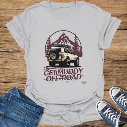 T-shirt graphic with vintage off-road vehicle, mountains, trees, and "Get Muddy Off-Road" text.