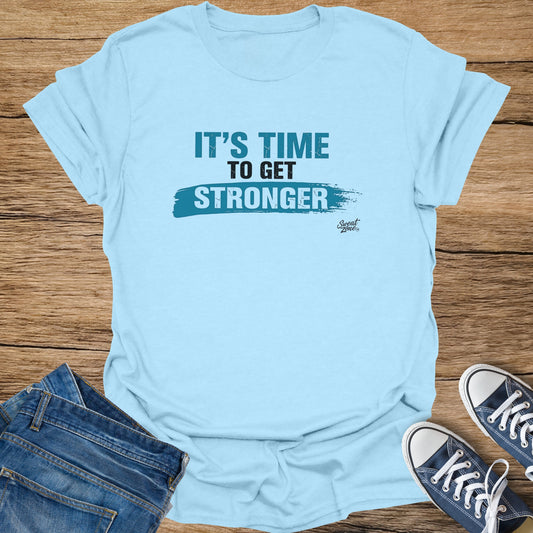 Light blue t-shirt with "IT'S TIME TO GET STRONGER" text and logo.