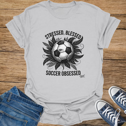 Light grey t-shirt with "Stressed, Blessed, Soccer Obsessed" text and soccer ball graphic.