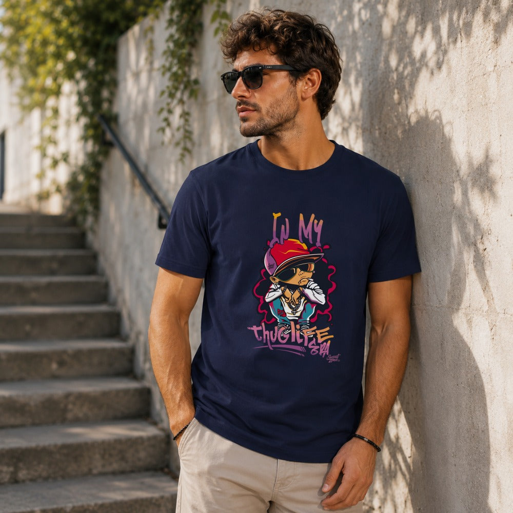 Navy t-shirt with cartoon print of a character wearing a red hat, sunglasses, and gold chain.