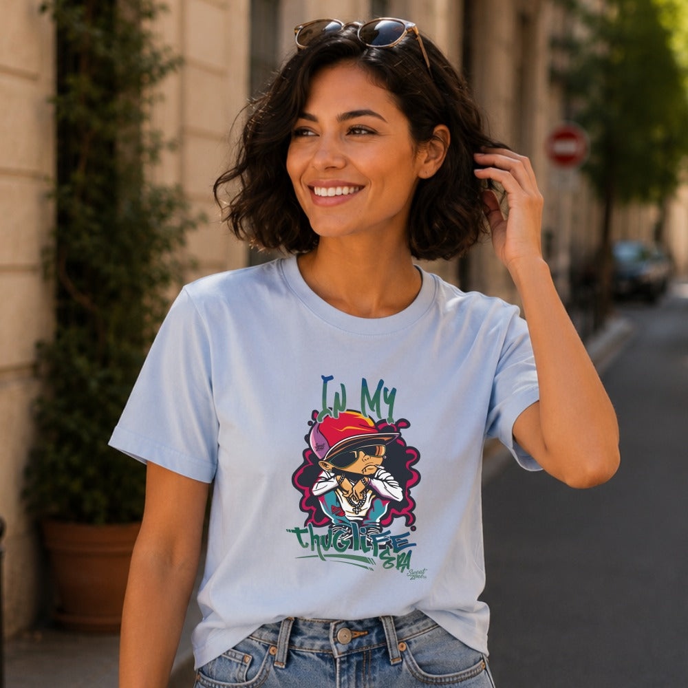 Light blue t-shirt with a cartoon character and the text "IN MY THUG LIFE ERA".