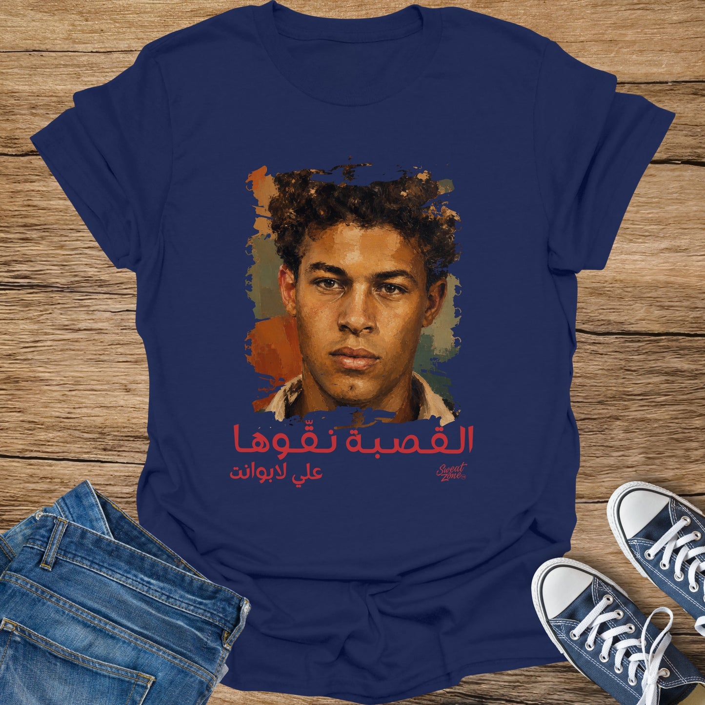 Navy t-shirt with a painted portrait and Arabic text.