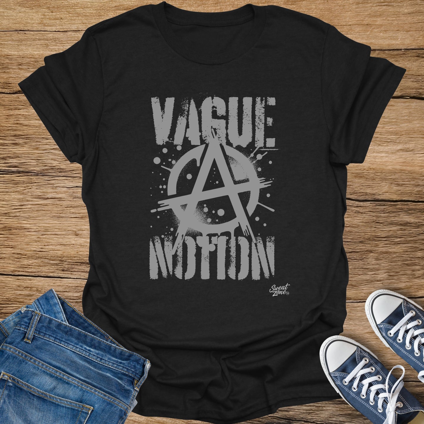 Black t-shirt with grey "VAGUE" and "MOTION" text and anarchy symbol.