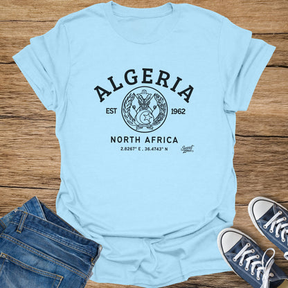 Light blue t-shirt with "Algeria" text, crest, "North Africa", and coordinates.