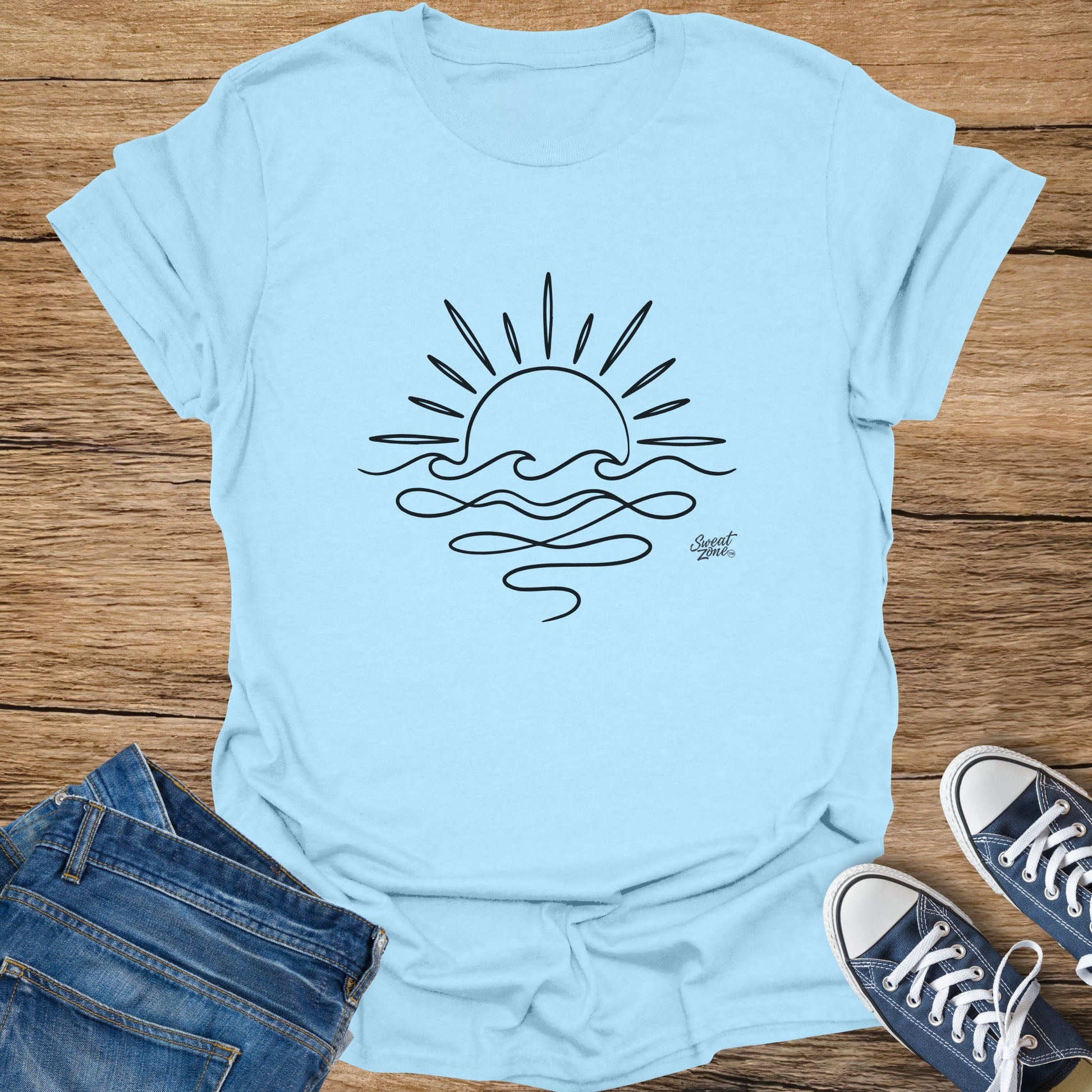 Light blue t-shirt with black outlined sun and waves graphic and "Sweat Zone" logo.