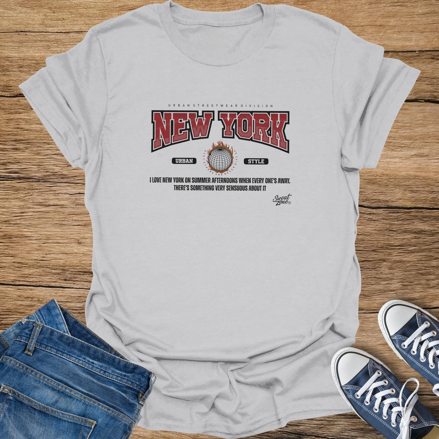 Grey t-shirt with "NEW YORK" text, globe graphic, and quote.