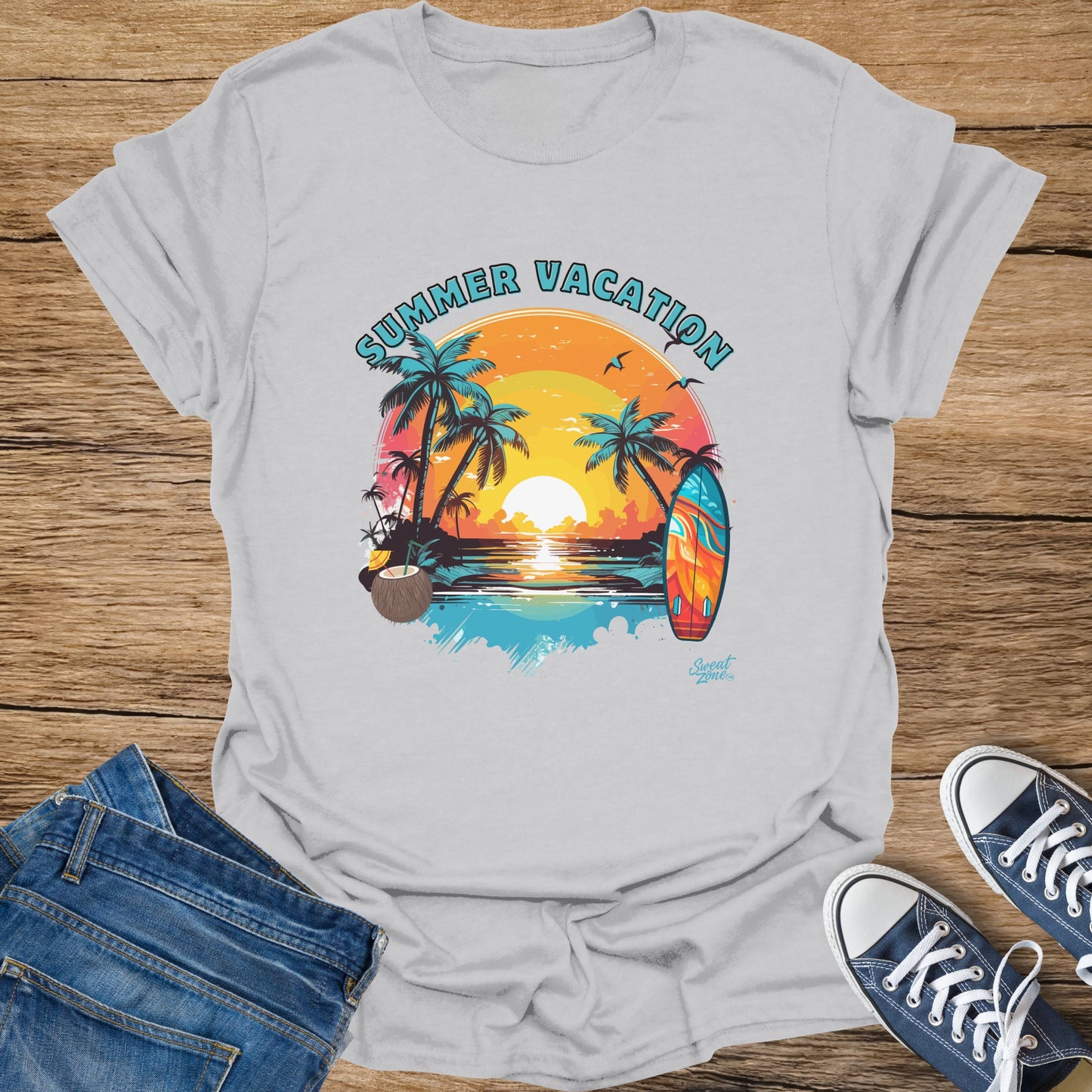 "Summer Vacation" graphic on a light grey t-shirt with palm trees and a surfboard.