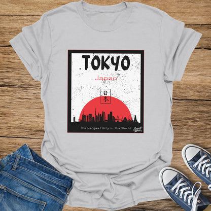 T-shirt with "TOKYO Japan" text, Japanese characters, skyline, and red sun.