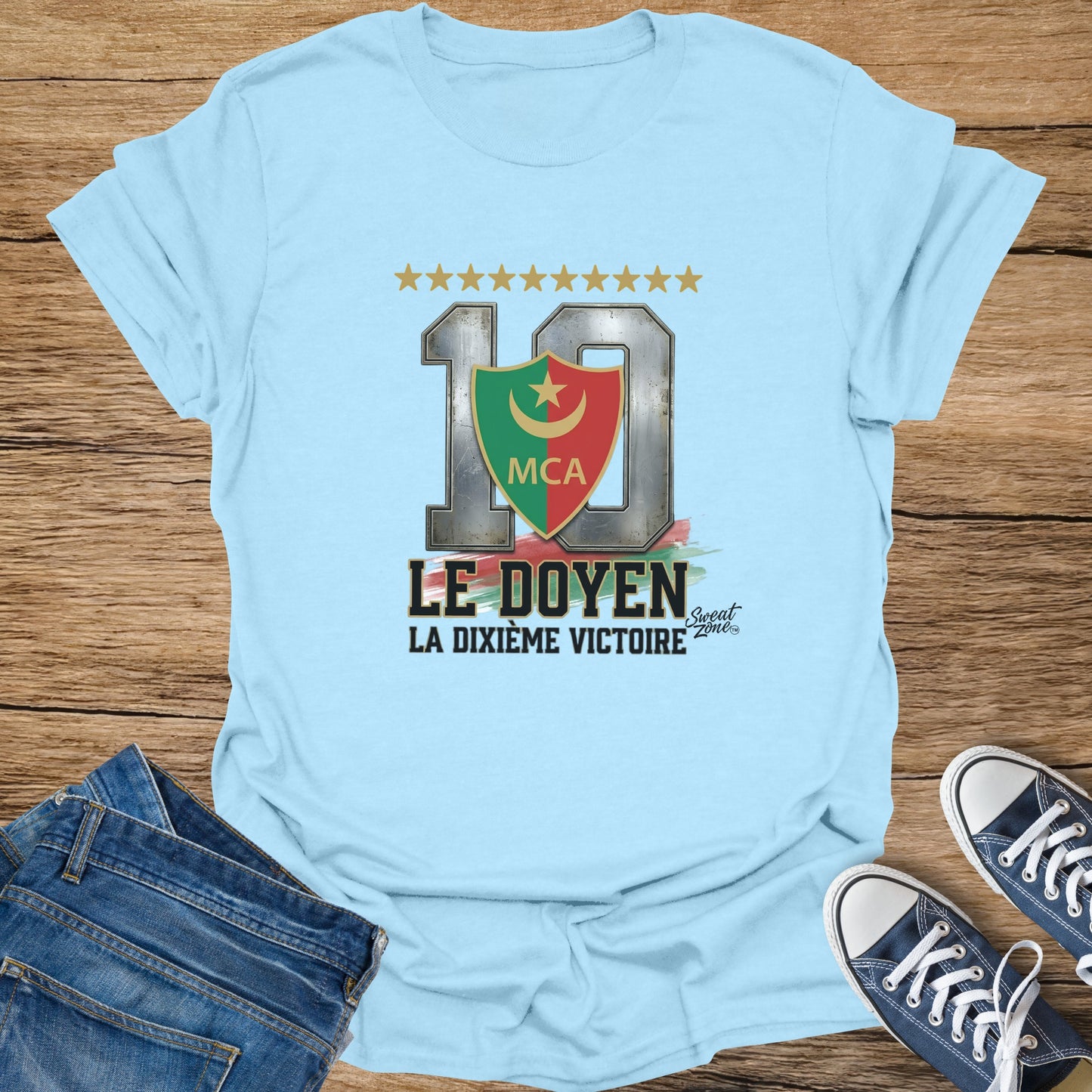 Light blue t-shirt with "10 LE DOYEN LA DIXIÈME VICTOIRE" design.