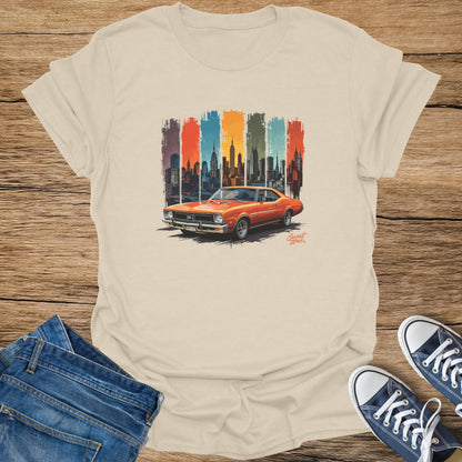 Cream t-shirt with vintage orange car and New York City skyline graphic.