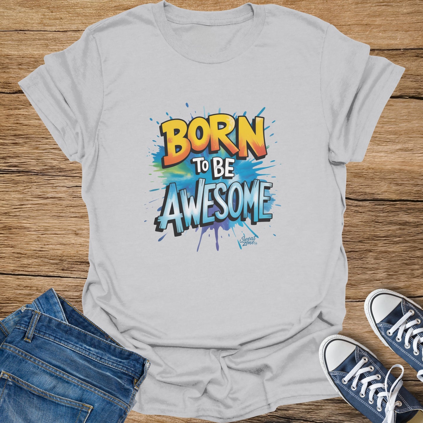 White t-shirt with "BORN TO BE AWESOME" text in colorful, graffiti-style lettering.