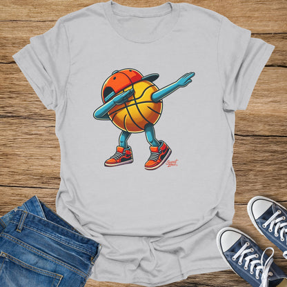Light gray t-shirt with a cartoon basketball character dabbing, wearing a hat and sneakers.