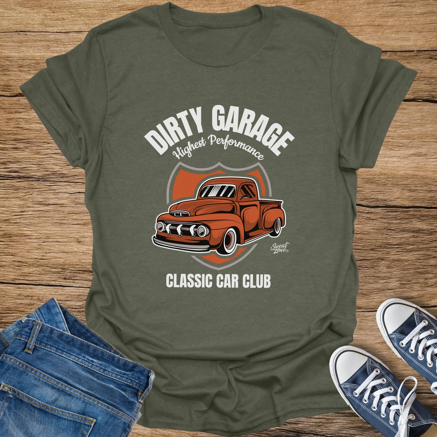 Olive green t-shirt with "DIRTY GARAGE Highest Performance CLASSIC CAR CLUB" and orange truck graphic.