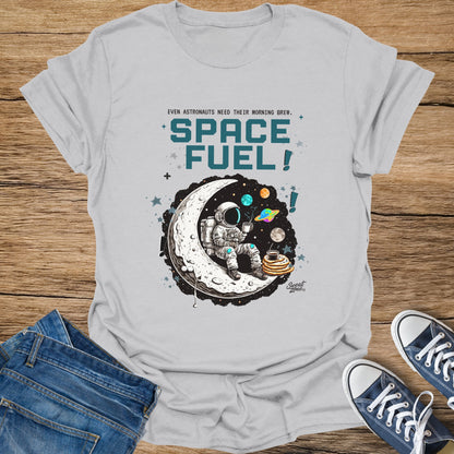 Astronaut seated on moon with coffee and pancakes, "SPACE FUEL!" text.