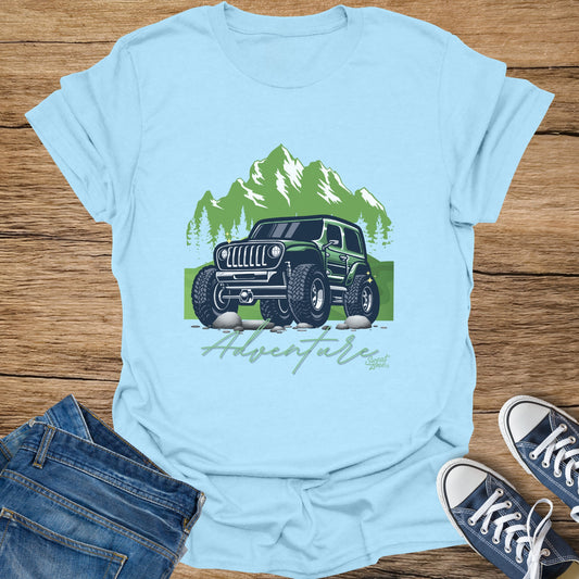 Green Jeep graphic with "Adventure" text on a light blue t-shirt.