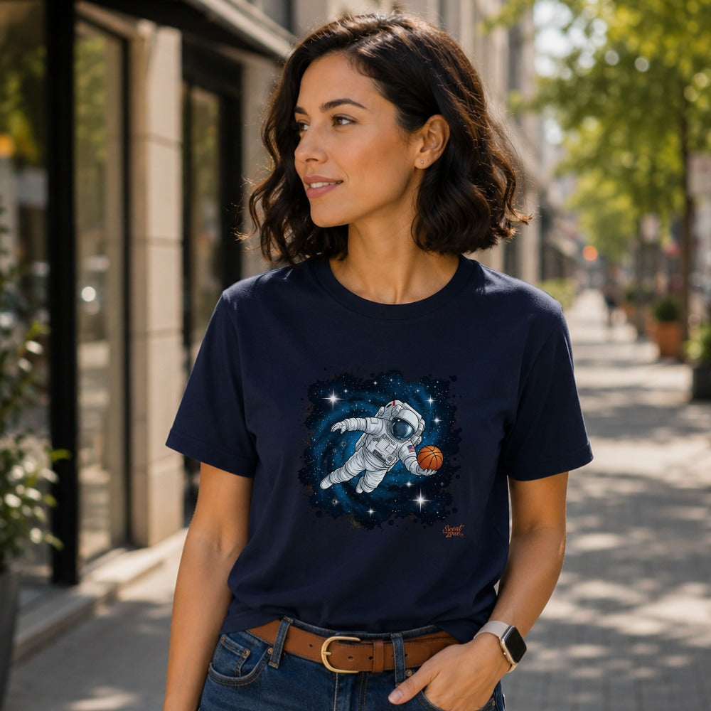 Navy t-shirt with astronaut playing basketball in space illustration.
