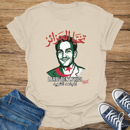 Cream t-shirt with graphic of Larbi Ben M'hidi and Arabic text.