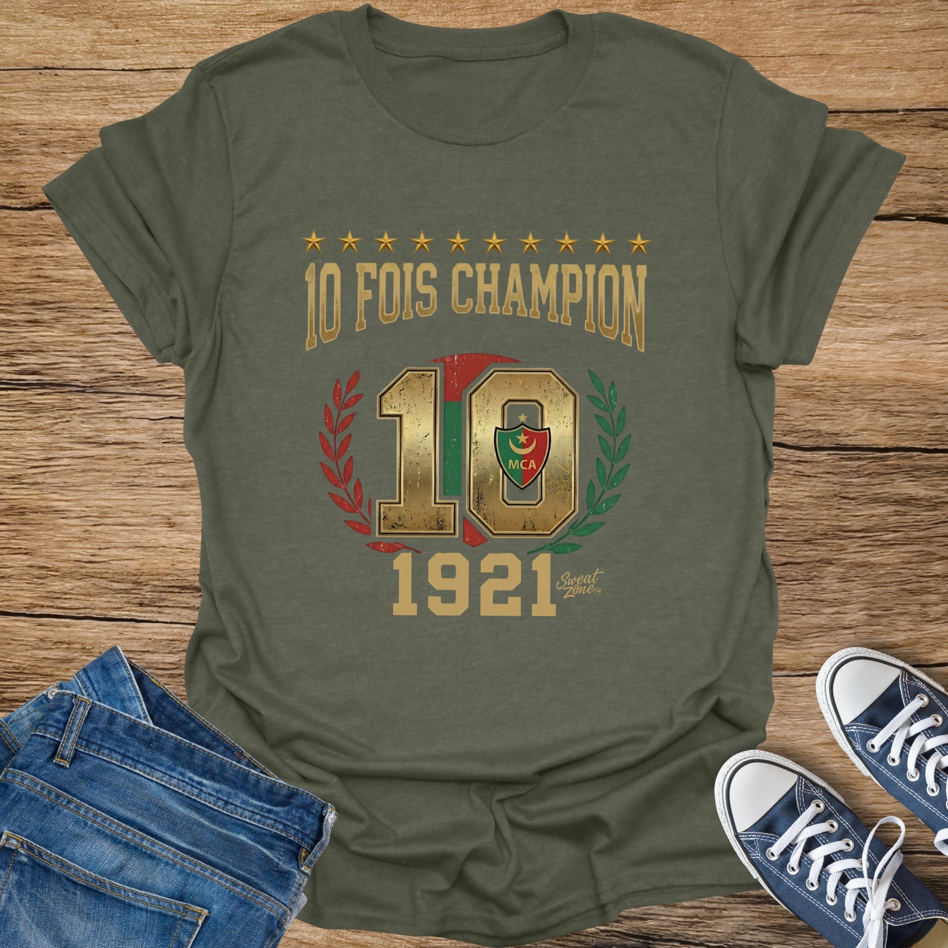 Olive t-shirt with golden text "10 FOIS CHAMPION 10 1921" and a crest.