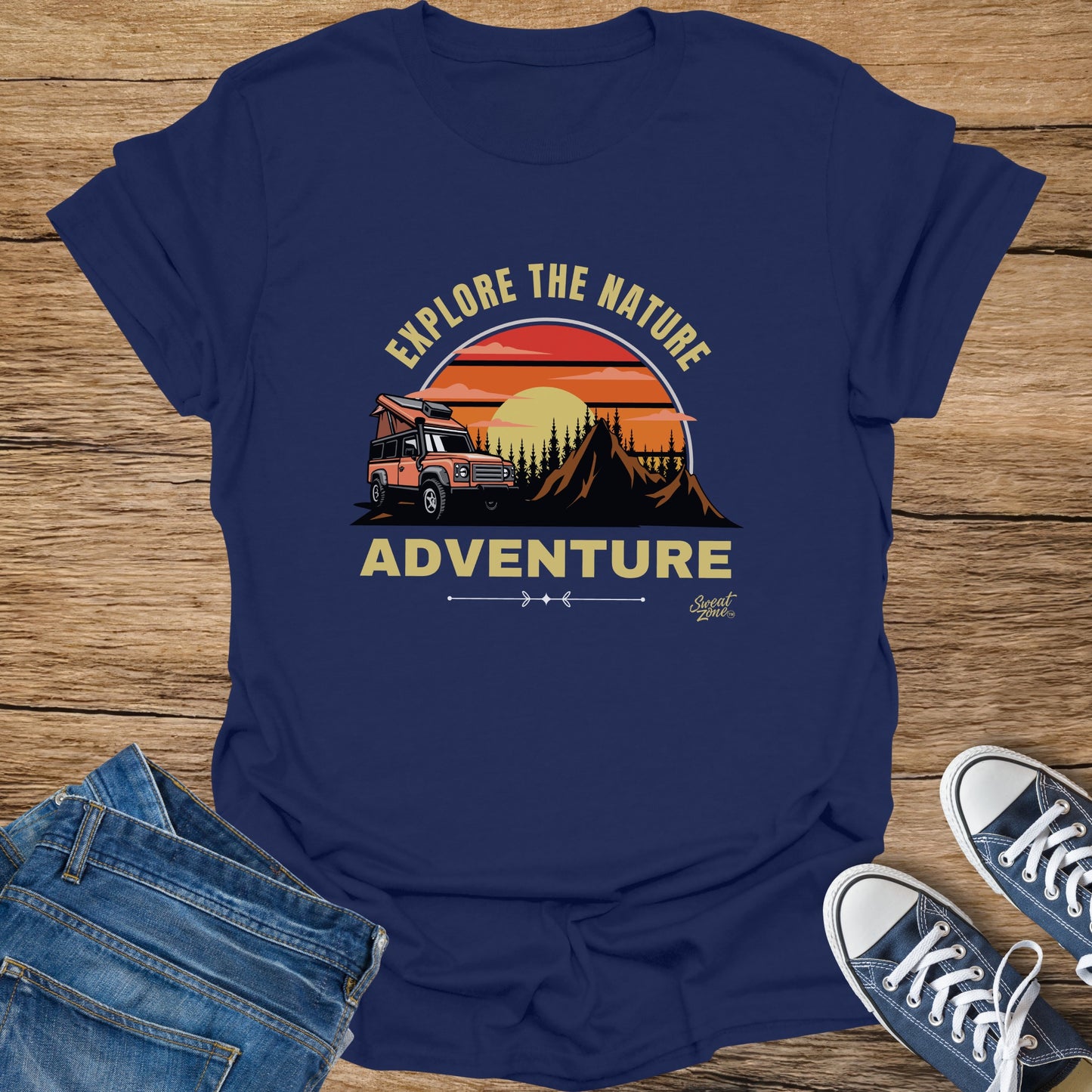 Navy t-shirt with graphic of orange camper and "Explore the Nature Adventure" text.