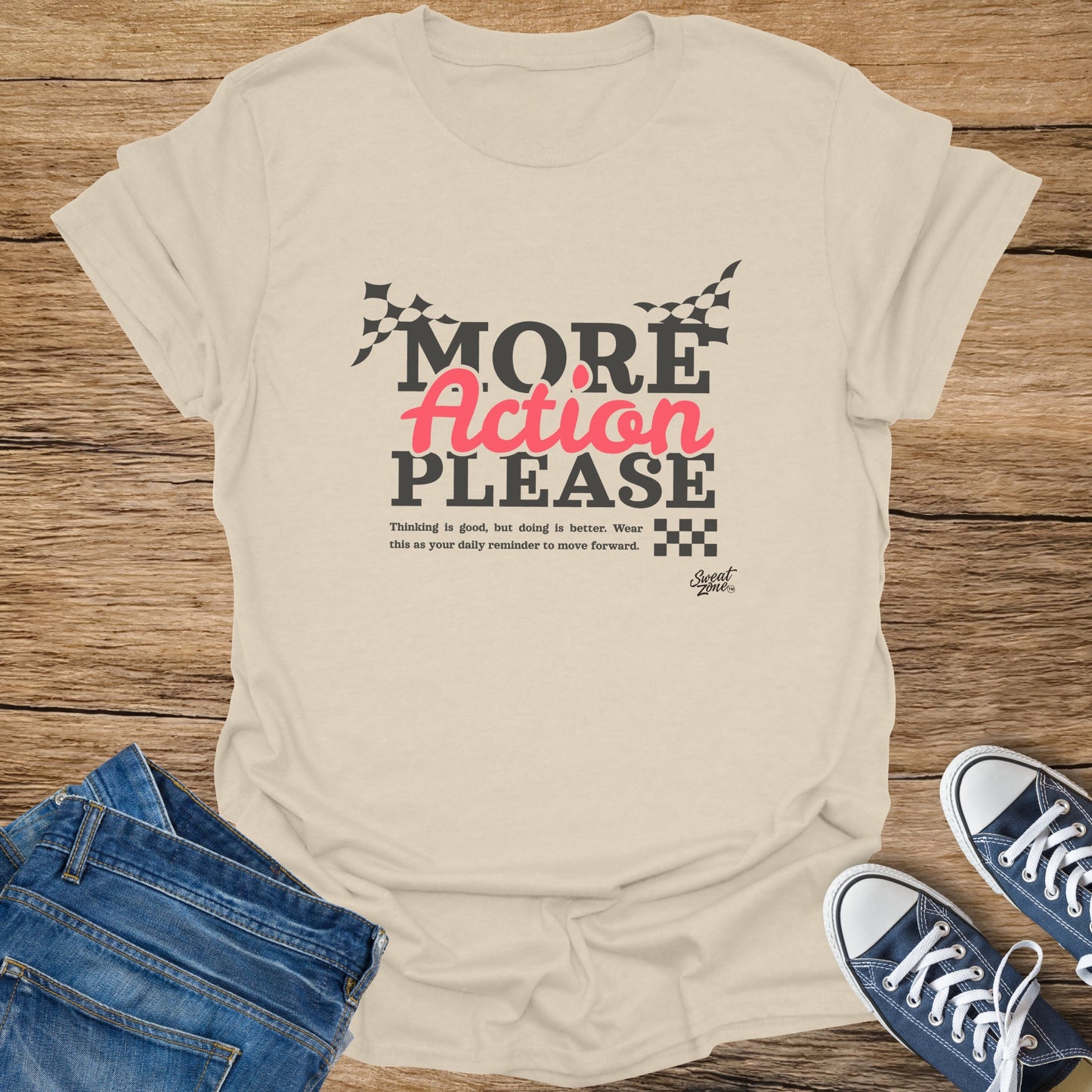 Beige t-shirt with "MORE Action PLEASE" text and checkered flags.